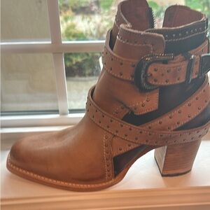 New in the box, too tall of a heel for me.  Runs big .